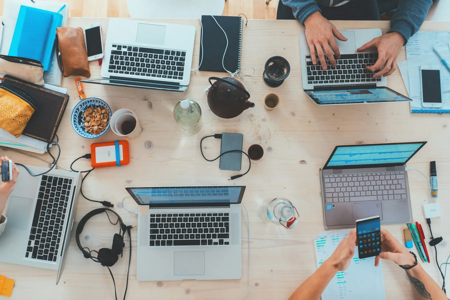 People working together around a table of computers