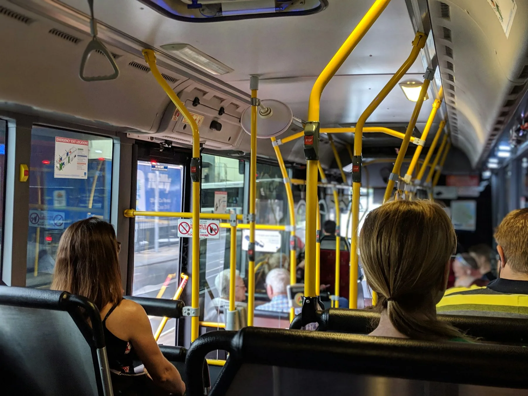 Passengers seated inside a city bus