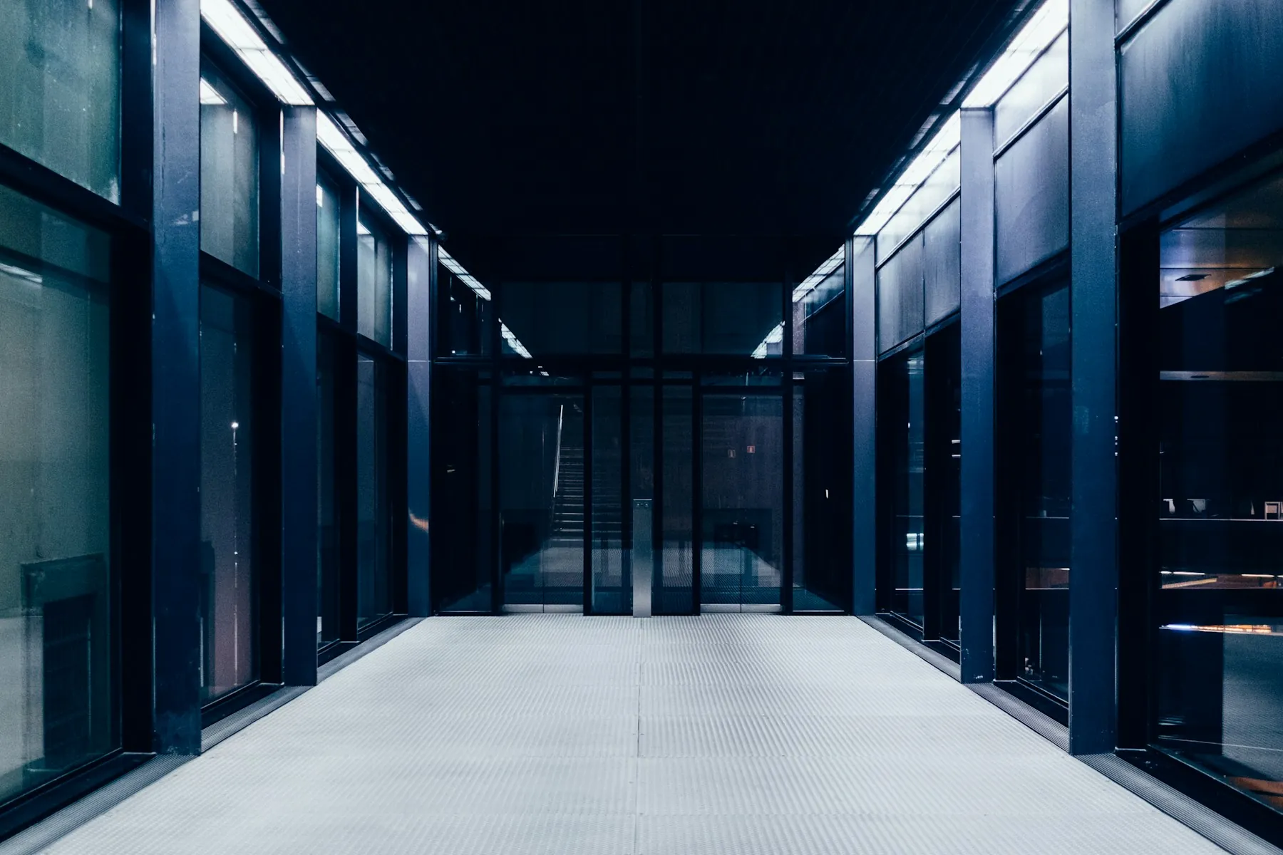 A long secured hallway in a technology facility