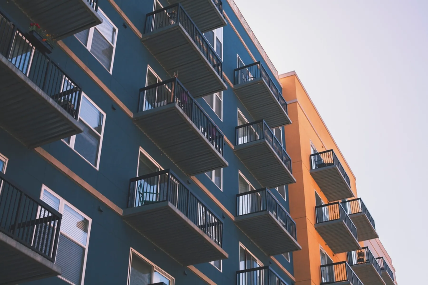 Balconies on a blue and orange apartment block