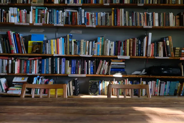 A quiet library with wooden tables and bookcases